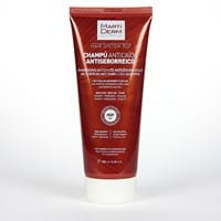 ¿Qué champú o loción debo usar para eliminar placas de dermatitis seborreica en cuero cabelludo?